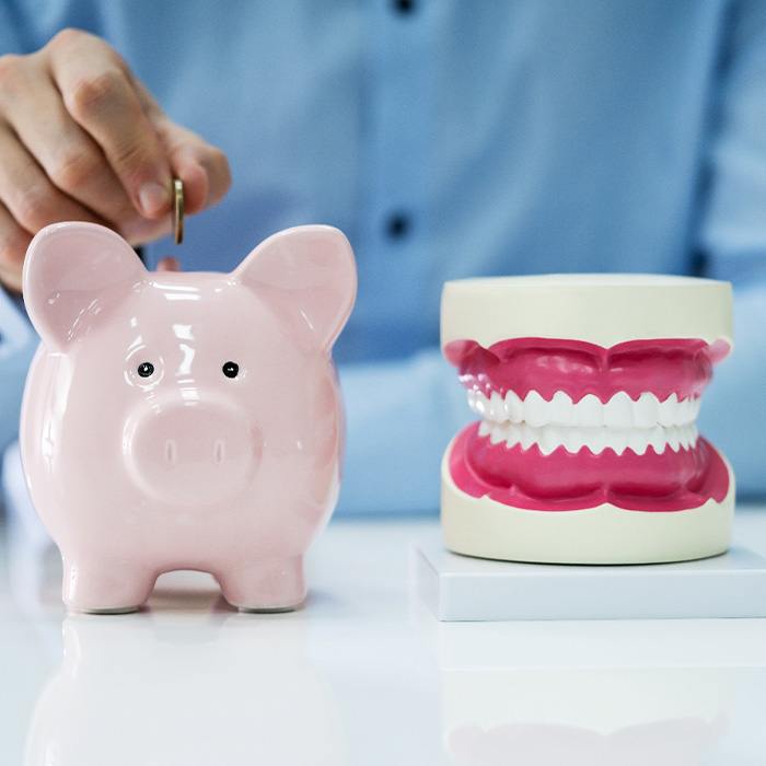 Patient in Charlottesville budgeting for cosmetic dentistry