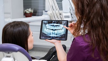 Patient in Charlottesville talking to dentist about cosmetic dentistry